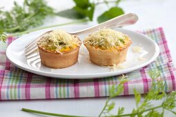 Asparagus muffin with carrot leaves and lemon balm
