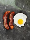 Fried egg and bacon (seen from above)