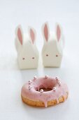 A doughnut and Easter bunnies made from paper