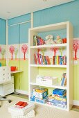 For kids - landscape wall stencils and sliding closet doors; in front open shelving with toys