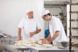 Two bakers at work