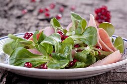 Lamb's lettuce with pomegranate and ham