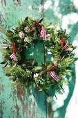 Wreath of herbs with red gingham ribbons