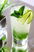 Mojito with lime slices and mint