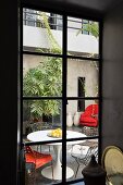 Eero Saarinen table in courtyard of Moroccan riad in Marrakesh