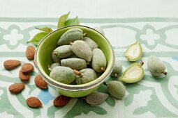 Green almonds and brown almond seeds