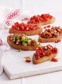 Bruschetta with tomatoes, peppers, avocado and chanterelle mushrooms