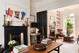 Danish rosewood coffee table in centre of sitting room with victorian fireplace