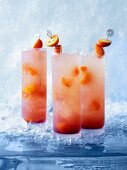 Asian Sling cocktails with kumquats and orange juice