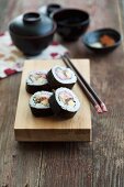 Maki sushi with tuna, egg, cucumber and prawn