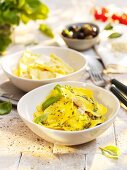 Cheese ravioli and pumpkin ravioli with pesto