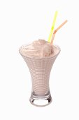 An ice cream shake with two straws