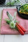 A knife and a name card wrapped with nigella and cow parsley