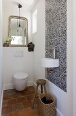 White designer bathroom fixtures in a Mediterranean bathroom