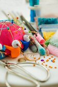 Pin cushions, scissors, buttons and craft supplies