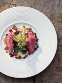 Wild pigeon breast with frisee lettuce