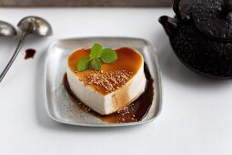 A heart made of tofu with a soy reduction