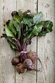 A fresh beetroot on a wooden surface