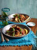 Tofu curry with sweet potatoes, sugar snap peas and cashew nuts