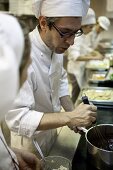 A young chef making chocolate cream