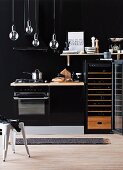 Kitchenette against black wall