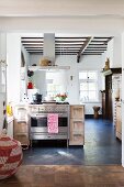 Open-plan kitchen in renovated country house