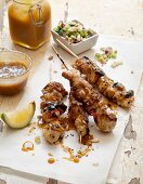 Chicken skewers with salted caramel sauce