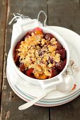 Plum Crumble in Individual Baking Dish; Spoon