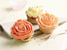 Cupcakes decorated with cream roses