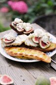 Monk fish on white bread with figs and goat's cheese
