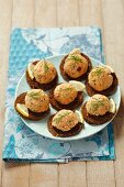 Pumpernickel canapes topped with crayfish paste