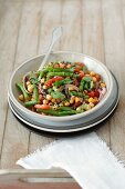 Chickpea salad with green beans, tomatoes, onions and mint