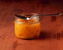 A jar of pineapple, mango and passion fruit jam with chilli