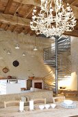 Loft-style interior in tower with wood-beamed ceiling & industrial staircase in Chateau Maignaut (the Pyrenees, France)