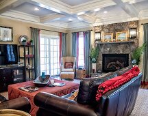 Living Room with Leather Furniture and a Stone Fire Place