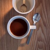 A cup of coffee with a coffee spoon