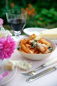 Rigatoni with tomatoes and basil, topped with melted cheese