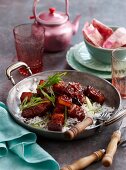 Honey-glazed pork on a bed of rice