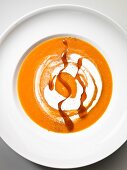 Carrot soup with cream and caramel (seen from above)