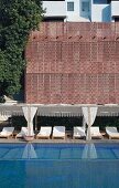 Luxurious swimming pool and loungers in Raas Haveli Hotel, Jodhpur, India