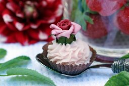 A cream cake of a marzipan rose