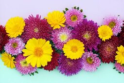 Flower arrangement of yellow marigolds and red and pink asters