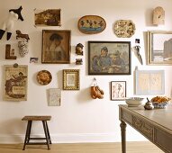 Eclectic gallery of pictures and memorabilia on wall