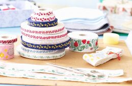 Rolls of ribbon in various patterns and colours