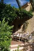 Range of seating on terracotta flooring in Mediterranean courtyard