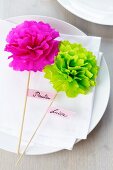 Name tags with tissue paper pompoms
