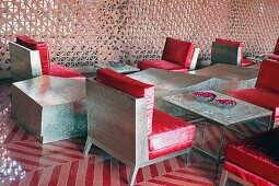 Devi Ratn Hotel - monolithic furnishings with red cushions in lobby