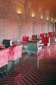 Devi Ratn Hotel - monolithic furnishings with red cushions in lobby
