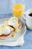Eggs Benedict (an English muffin with ham, poached egg and Hollandaise sauce, USA)