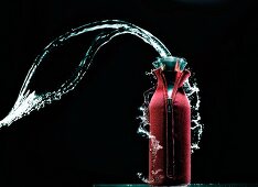 Stream of water coming out of a Thermos flask